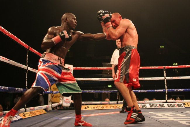 Eric Ochineg directs a punch at his opponent Frenchman Frederic Serre at the Wembley Arena London (Photo:Courtesy)