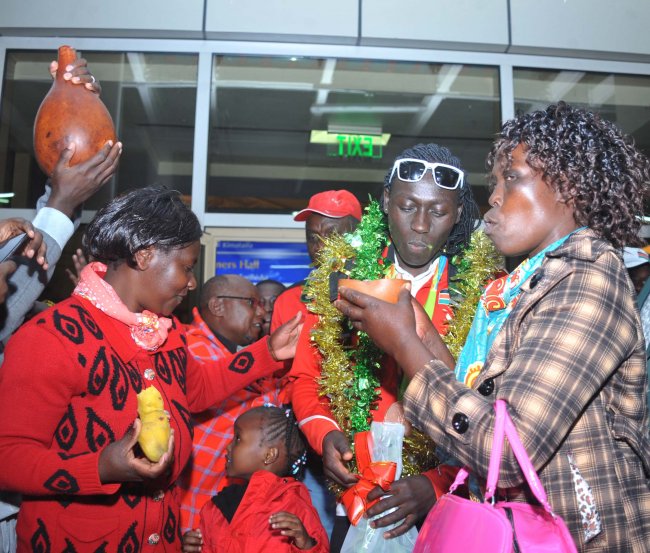 Margaret Nyairera is given a traditional welcome as the last batch of athletes arrived back from Rio. (Photo by Shutterspeed)