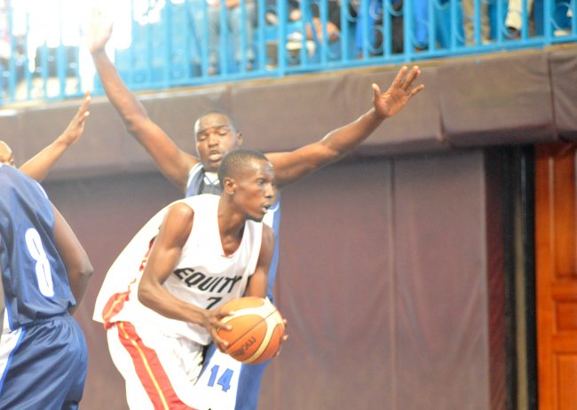 Kevin Chogo of Equitry Bank looks for a way out after William Ochieng from Ulinzi blocked his way. Ulinzi are top of the KBF men's Premier League.  (Photo by Shutterspeed)