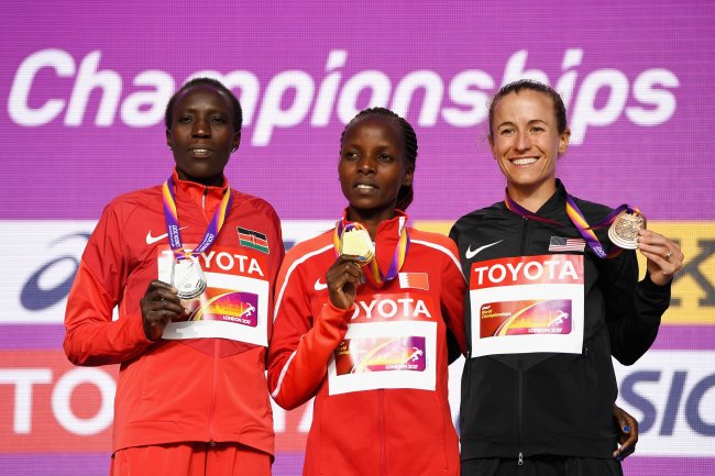 Edna Kiplagat poses with the silver medal, Rose Chelimo of Bahrain poses with the gold medal and Amy Cragg of the United States poses with the bronze medal for the Women's Marathon. (Photo IAAF)