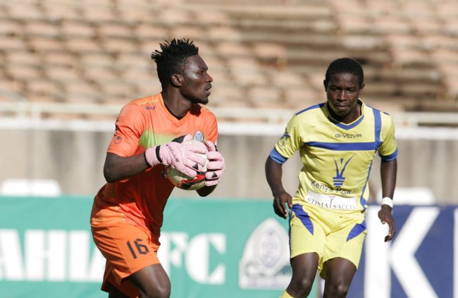 Gor Mahia goalkeeper Shaban Odhoji collects a ball under pressure from Western Stima's forward Brian Marita. (Photo by Shutterspeed) 