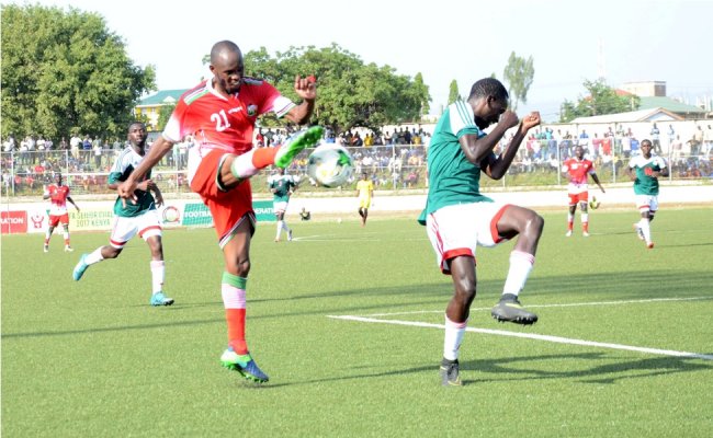 Kenya's Whyvonne Isuza attempts a shot past Burundi's Gael Duhayindavyi. He scored the lone goal in extra time. (Photo by Alex Wafula)
